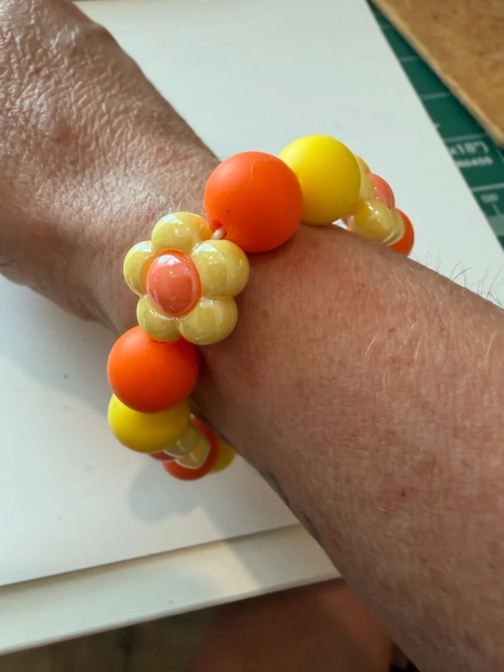 Hand Crafted Yellow and Orange Kids Flower Bead Stretch Bracelet - Picture 2 of 4